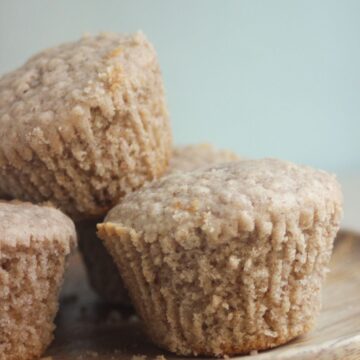 Oatmeal muffins on a wooden plate.