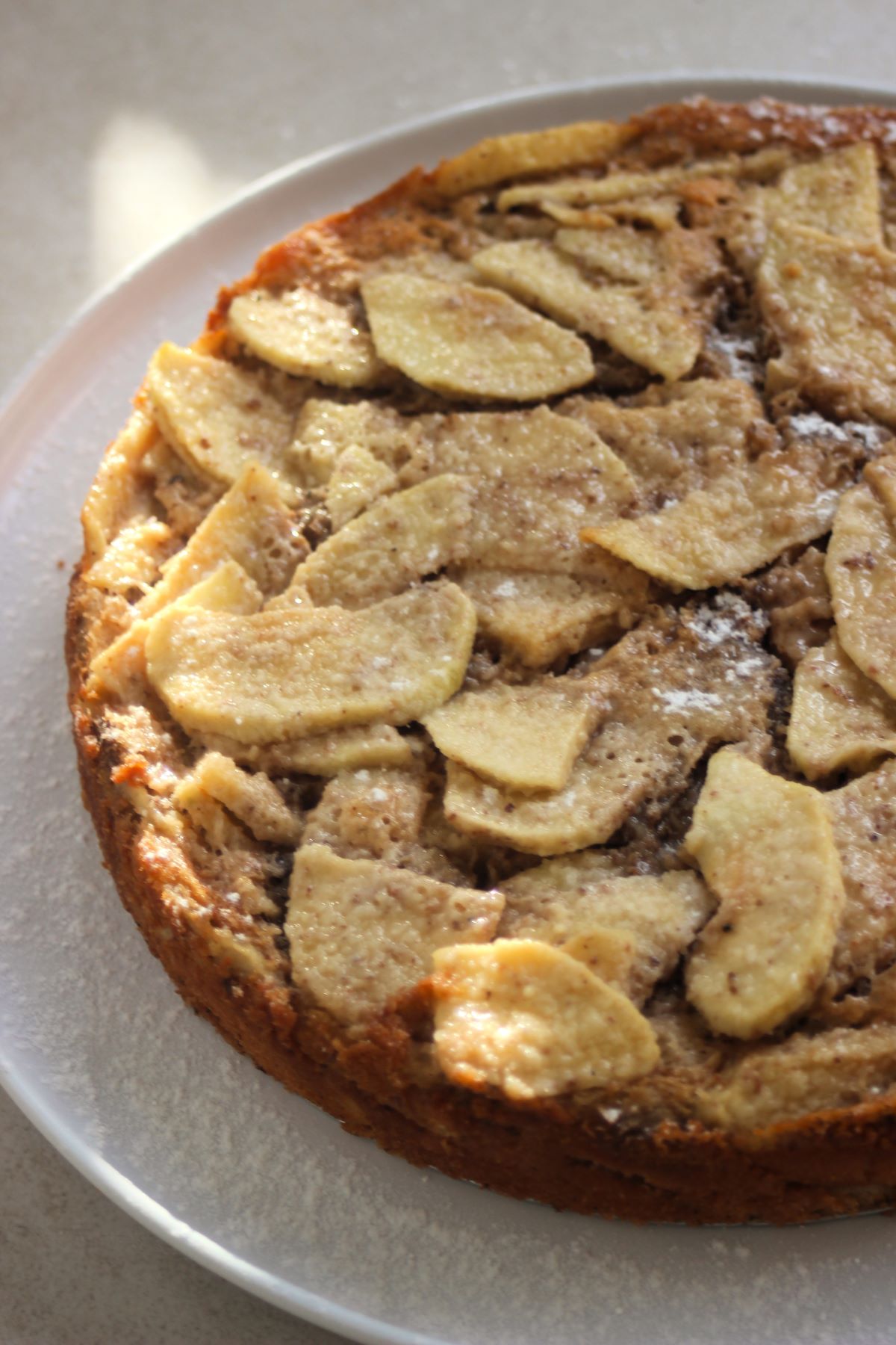 Apple cake on a white plate.