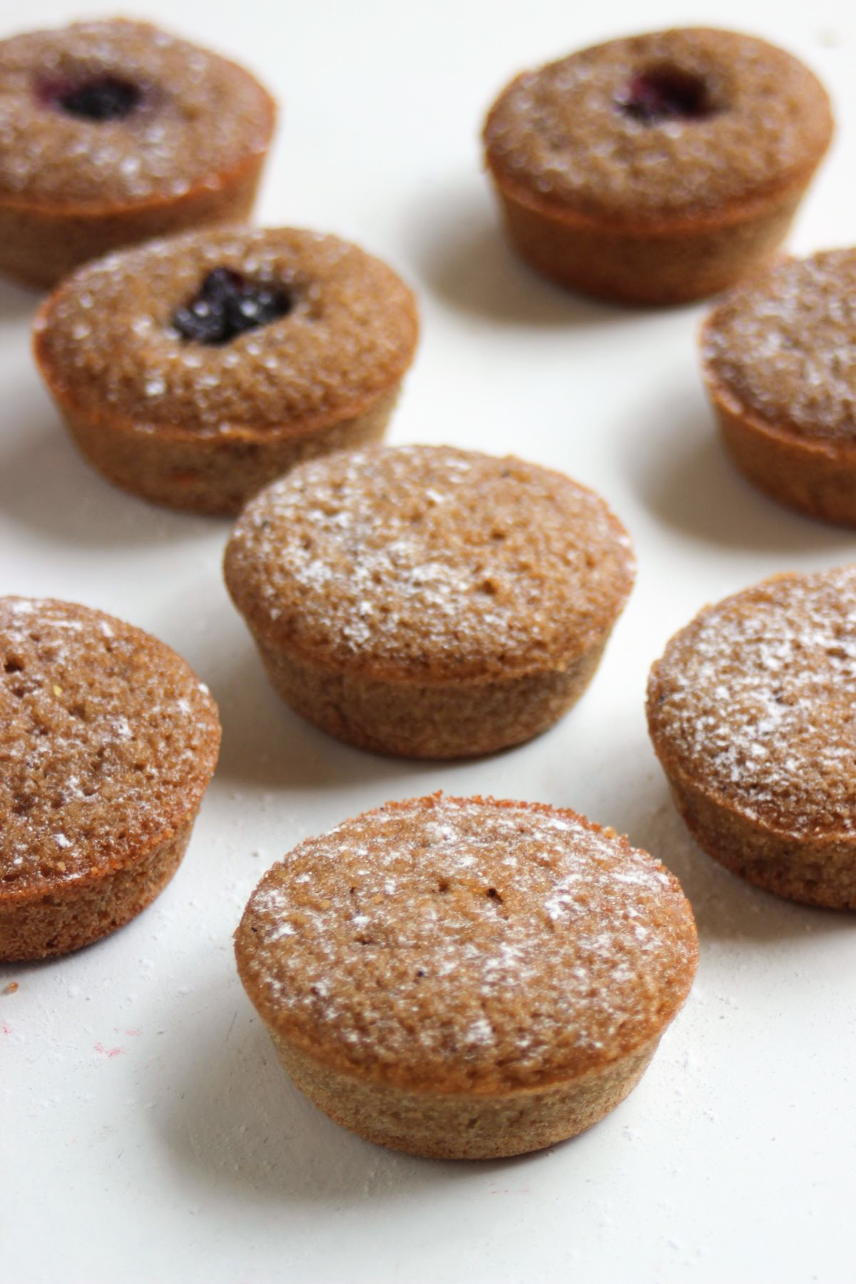 Many financiers on a white surface.