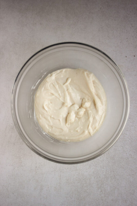 Glass bowl with a a smooth white mixture.