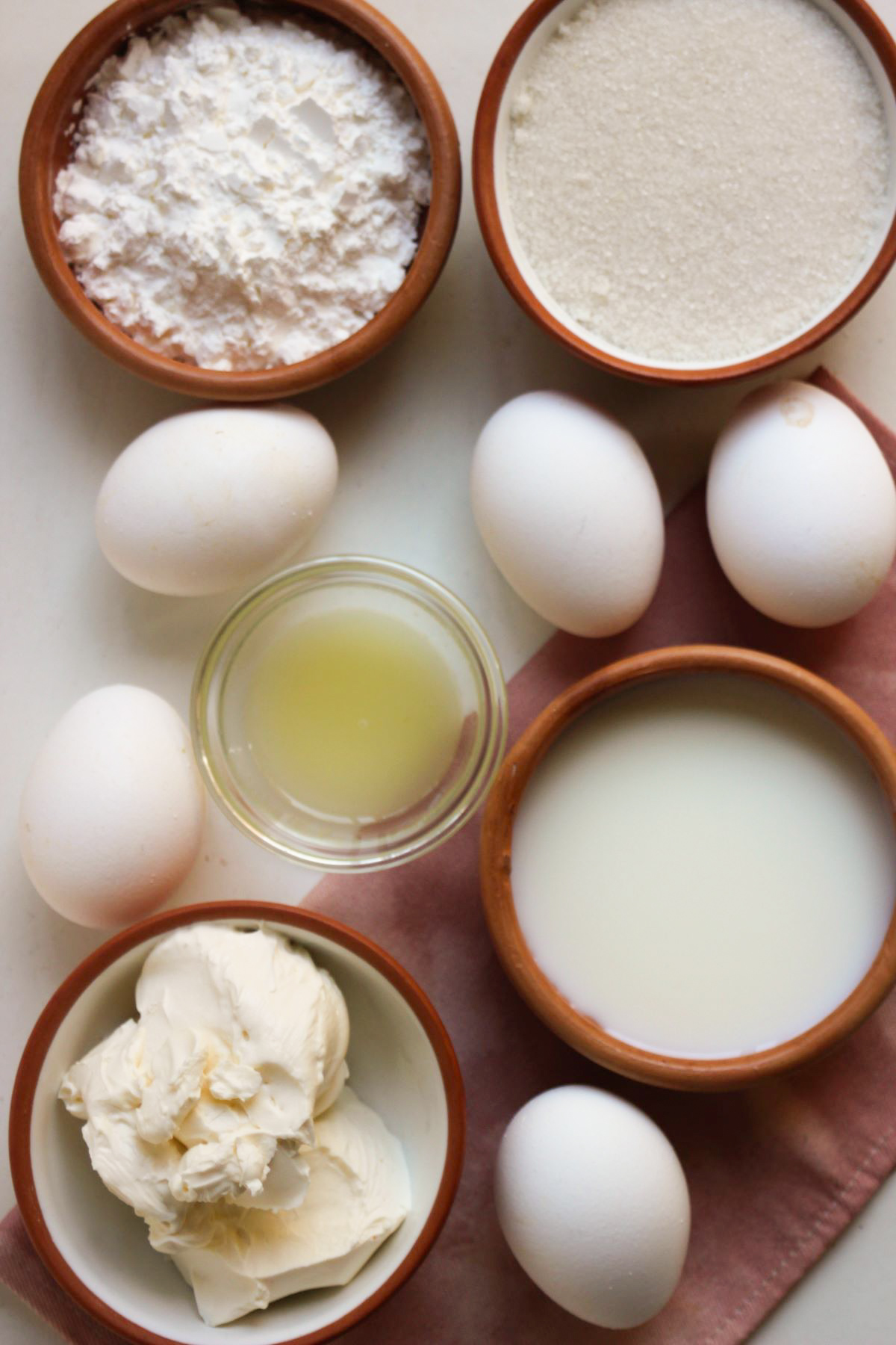 Japanese Cheesecake ingredients on a white surface seen from above.