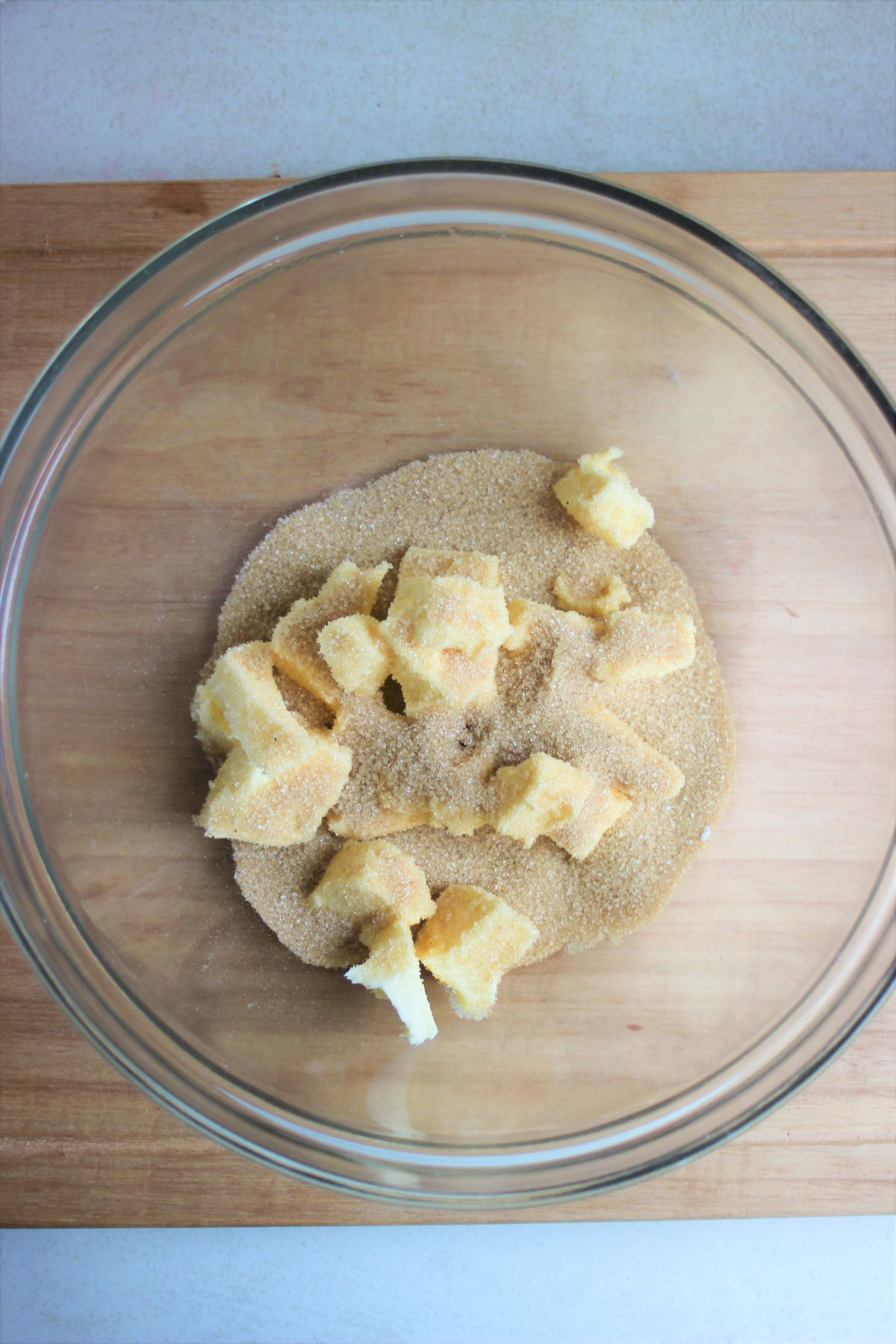 Glass bowl with sugar and diced butter.