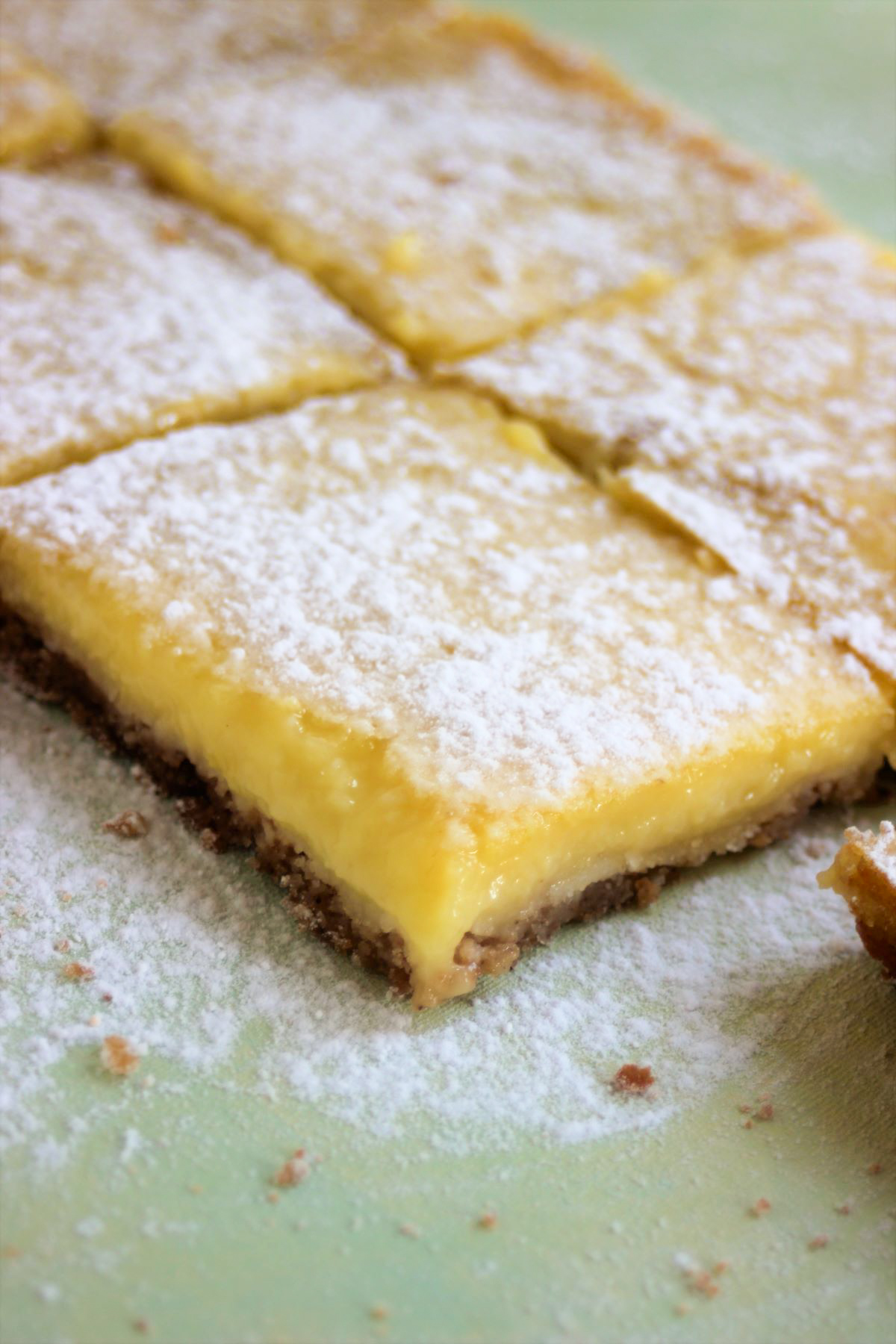 Lemon bars sprinkled with powdered sugar.