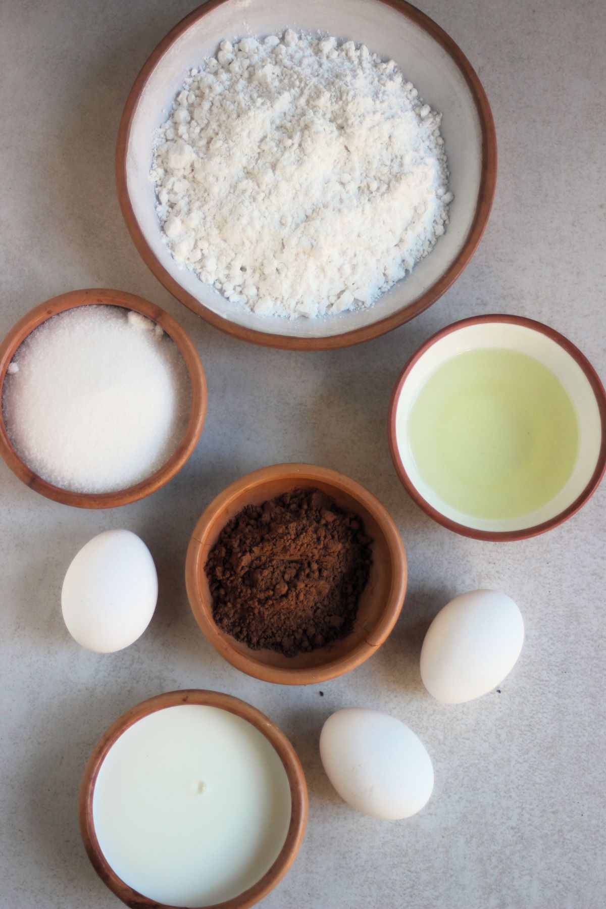 Marble Loaf cake ingredients on a white surface seen from above.