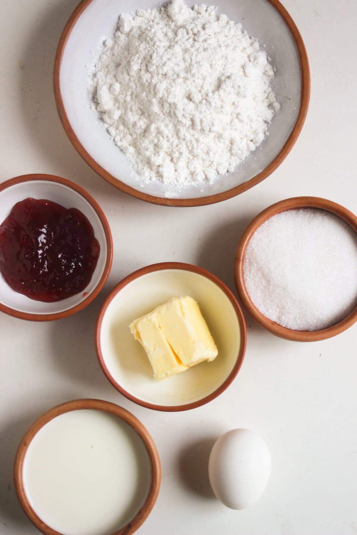 Scons ingredients on a white surface seen from above.