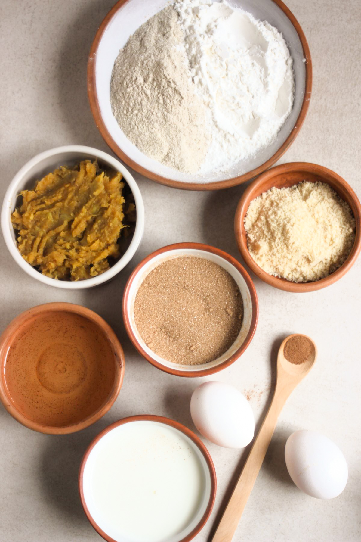 Sweet Potato Cake ingredients on a qhite surface seen from above.