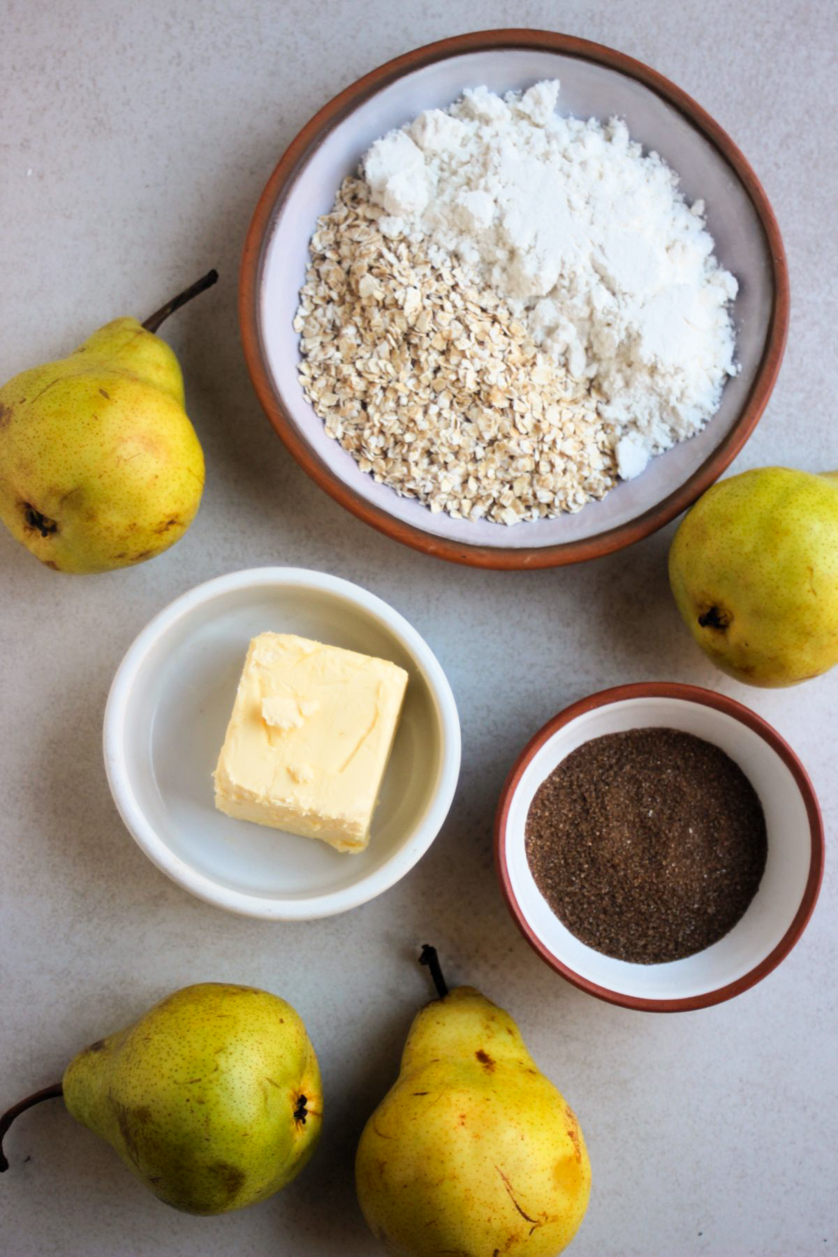 Top view pear Crisp ingredients on a white surface.