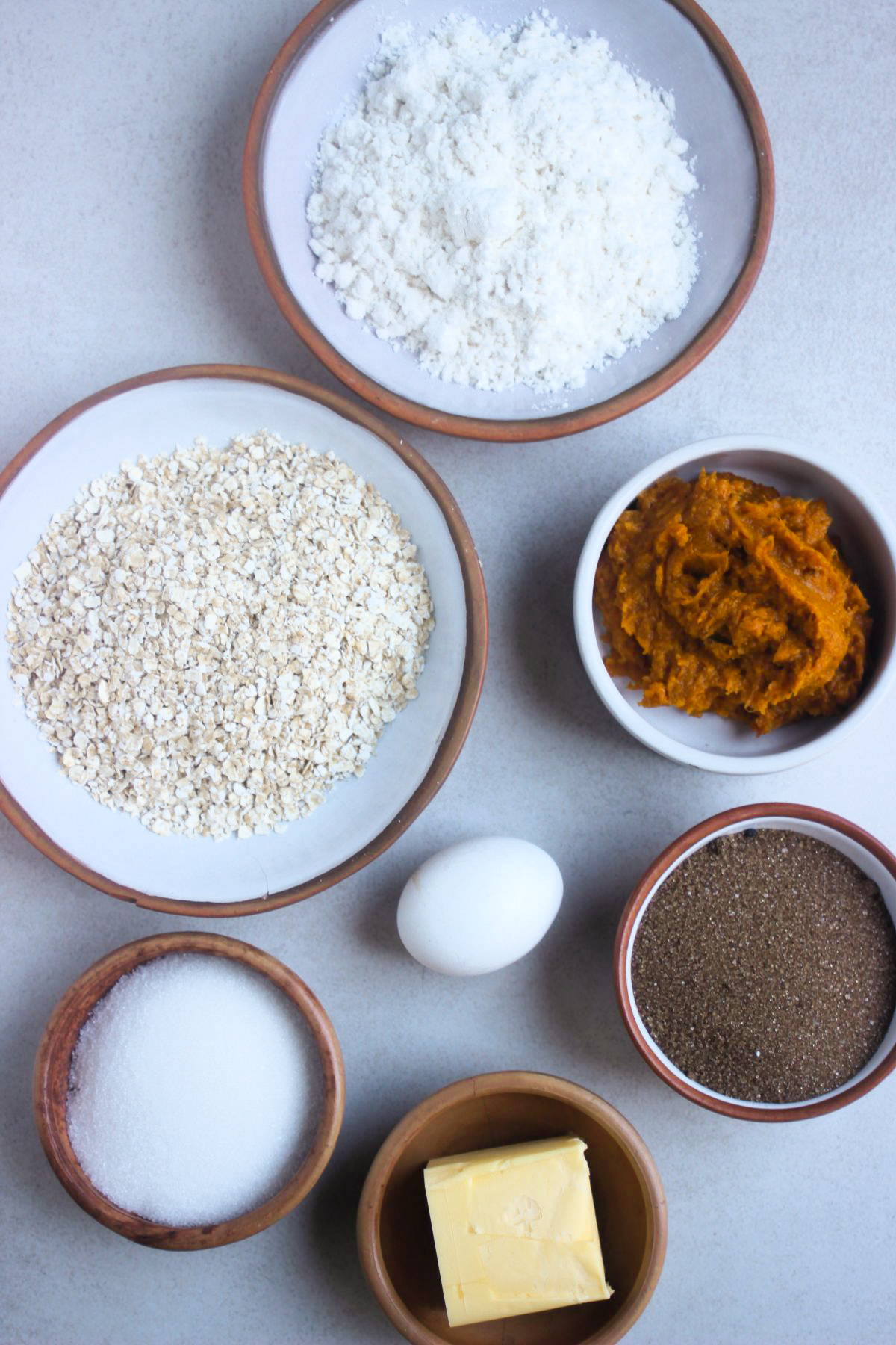 To view of pumpkin oatmeal cookies ingredients on a white surface.