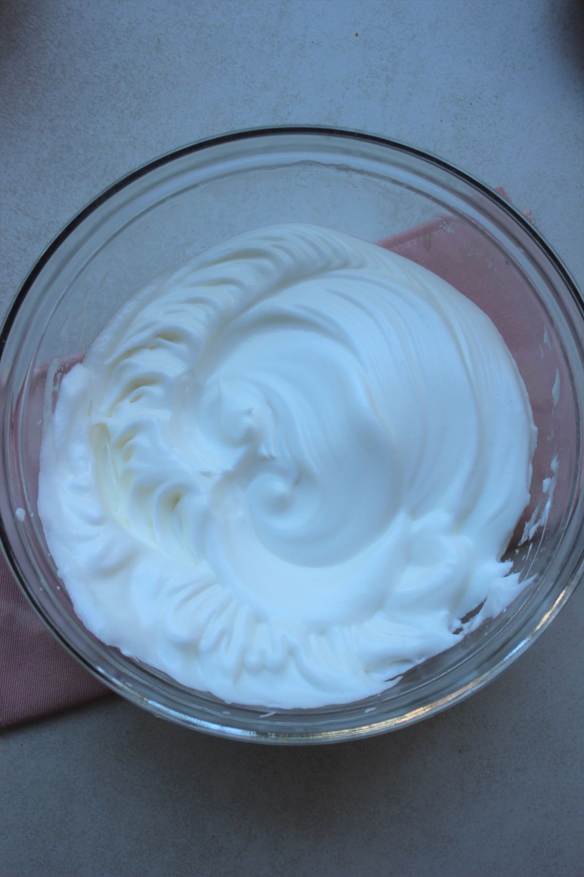 A glass bowl with meringue.
