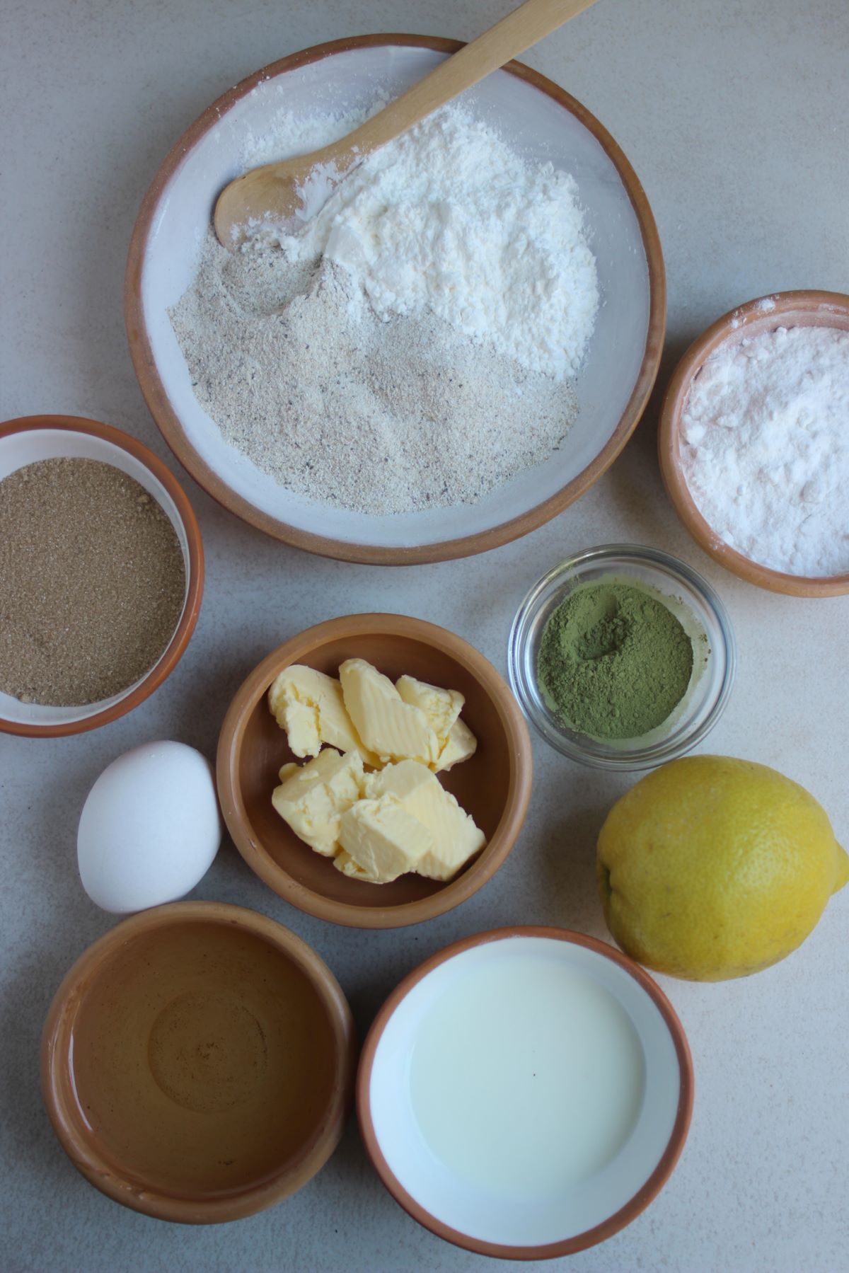 Matcha and lemon muffins ingredients seen from above.