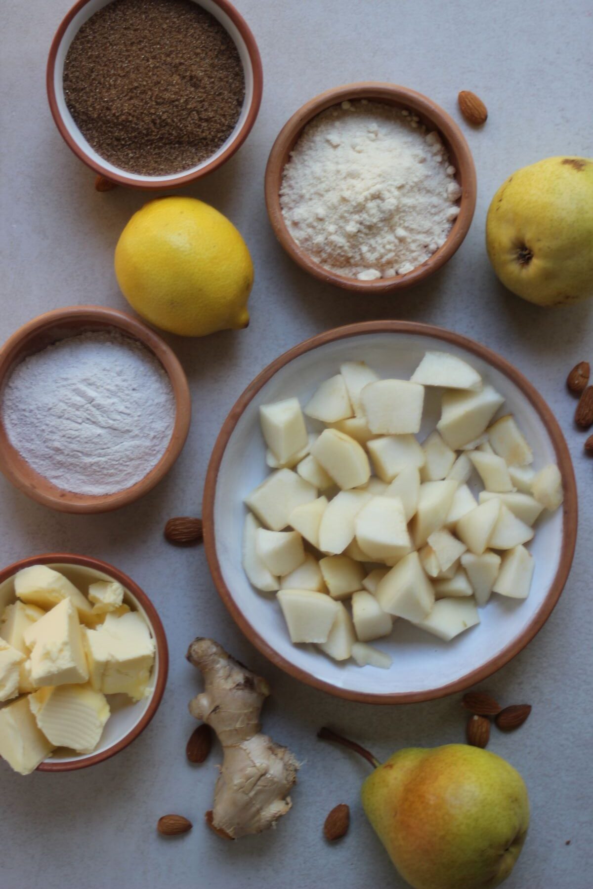 Pear and ginger crumble ingredients seen from above.