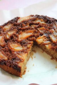 Pear upside-down cake without a piece.