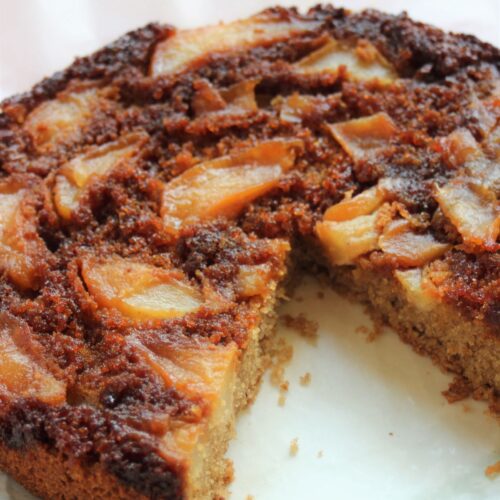Pear upside-down cake without a piece.