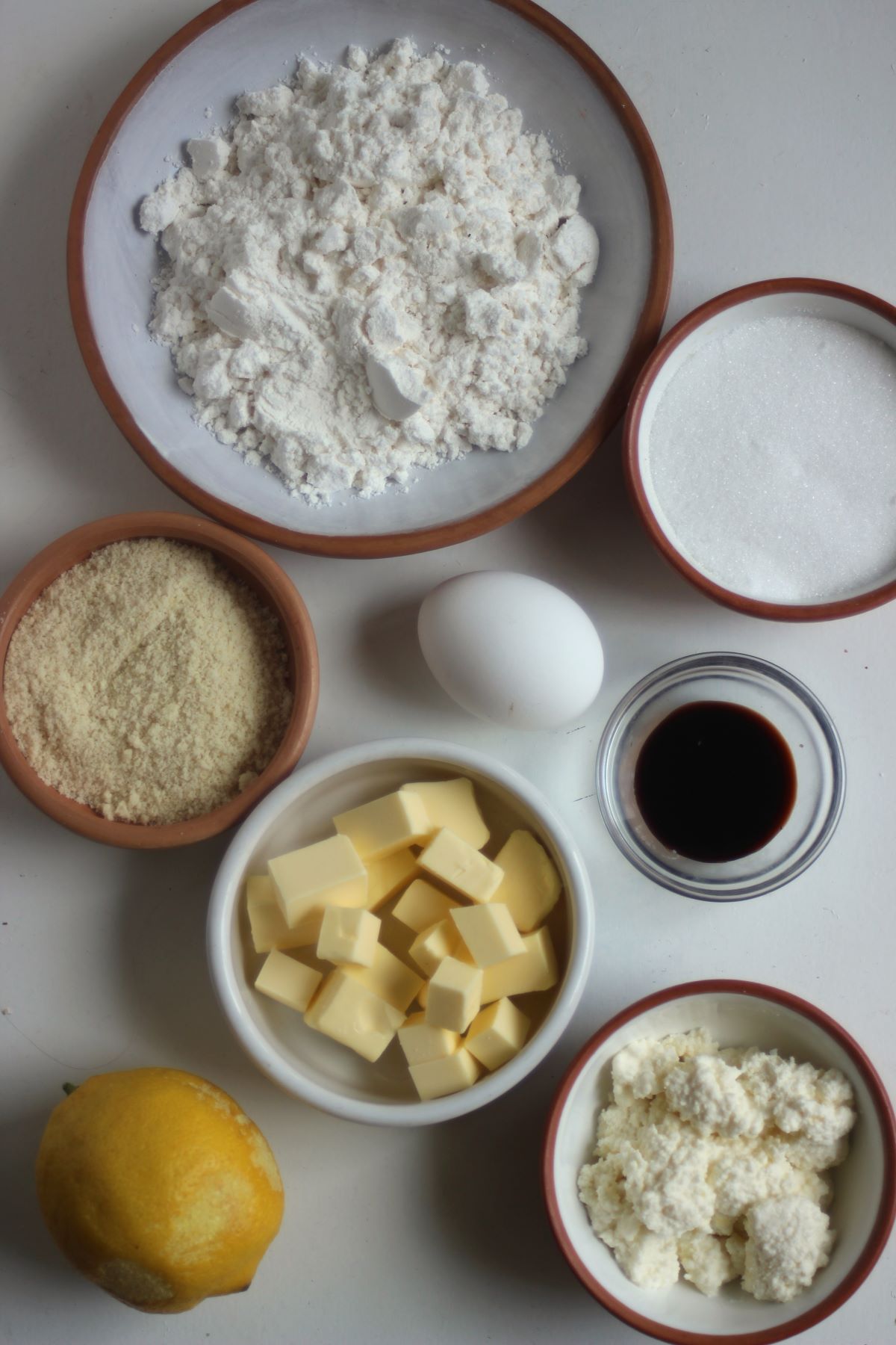 Lemon Ricotta Cookies ingredients in different plates seen from above.