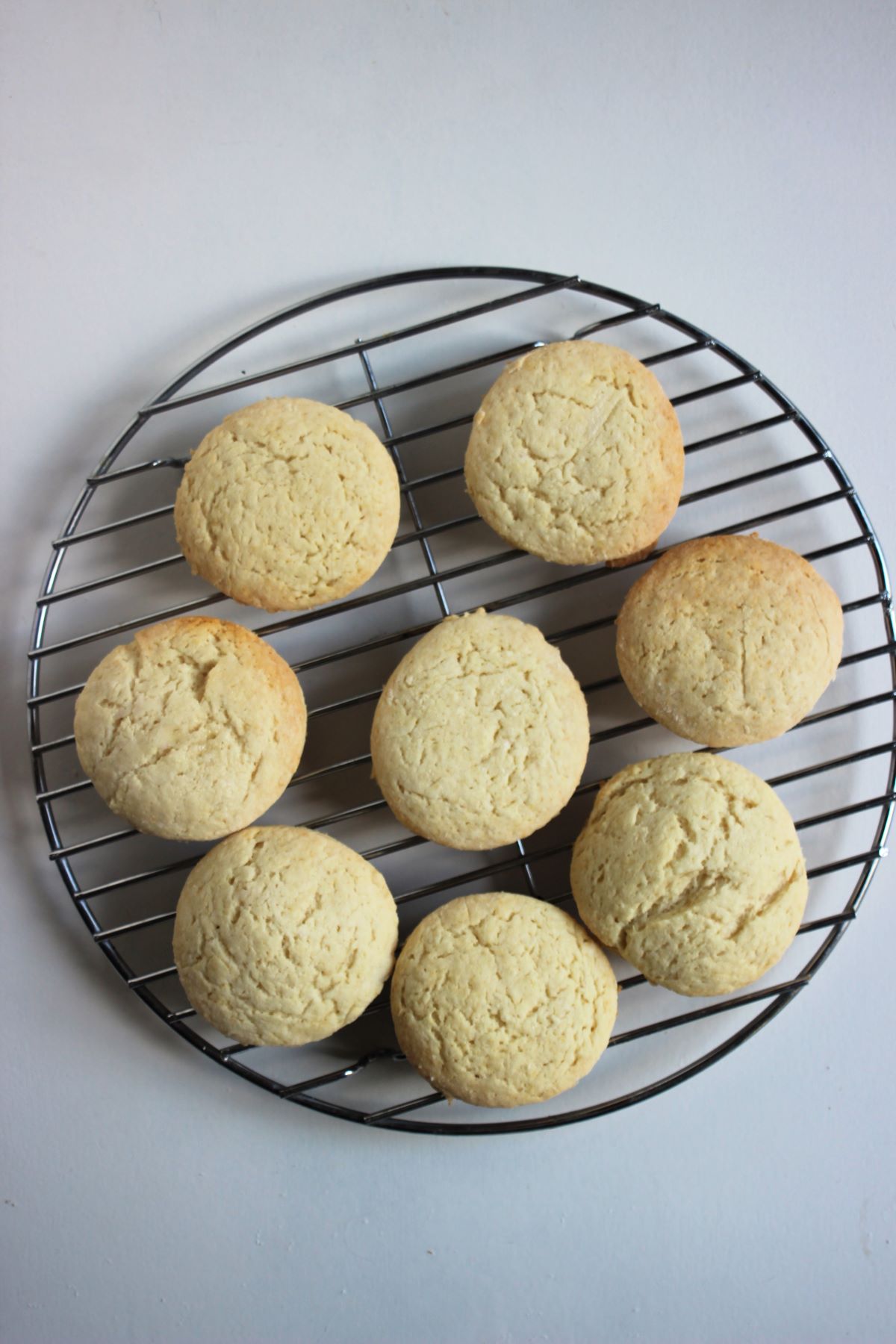 Shortcake biscuits on a round wire rack.
