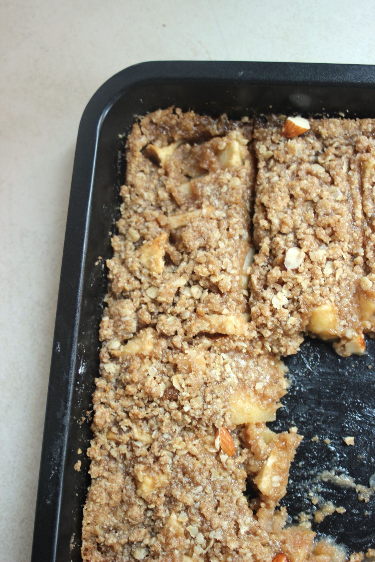 A baking dish with apple crisp seen from above.