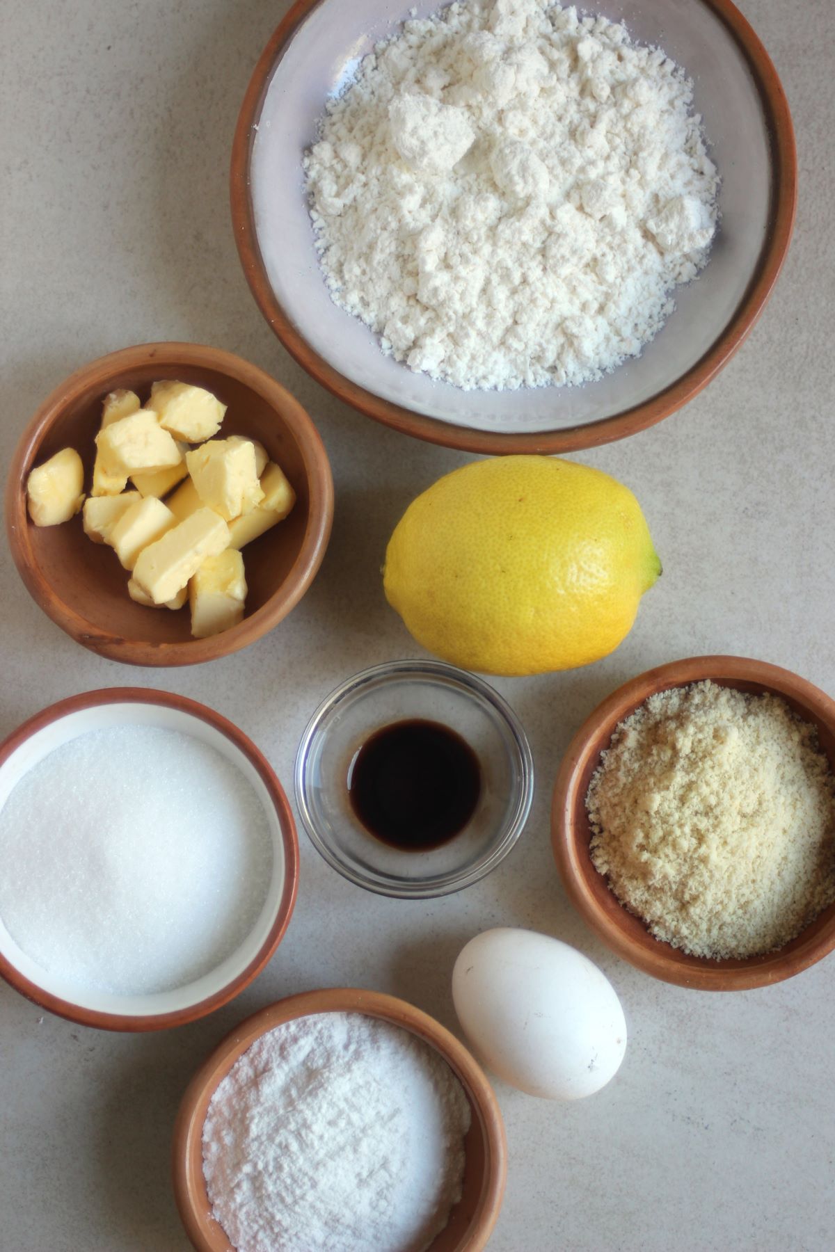 Lemon crinkle ingredients on a white surface seen from above.