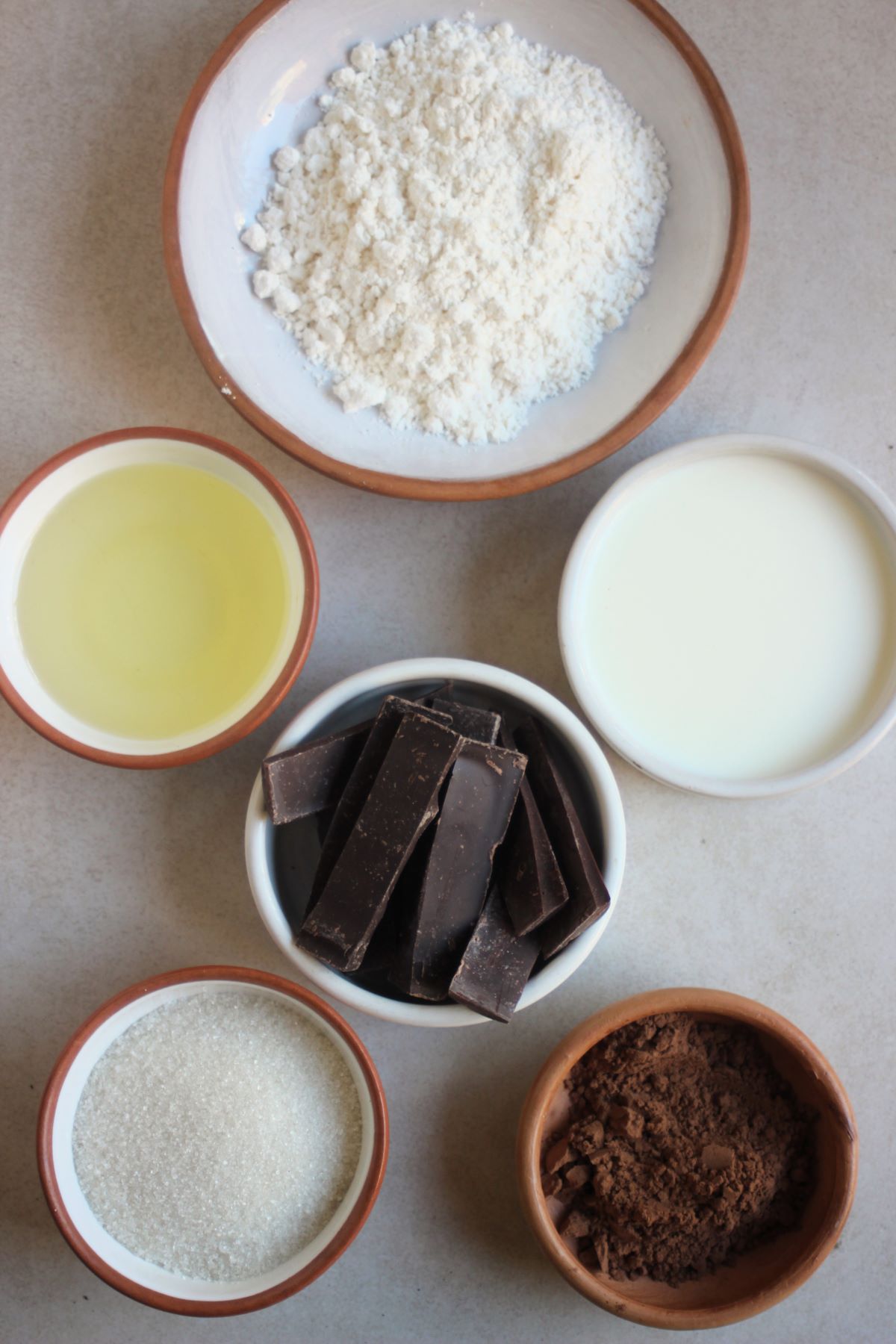 Brownie ingredients on a white surface seen from above.