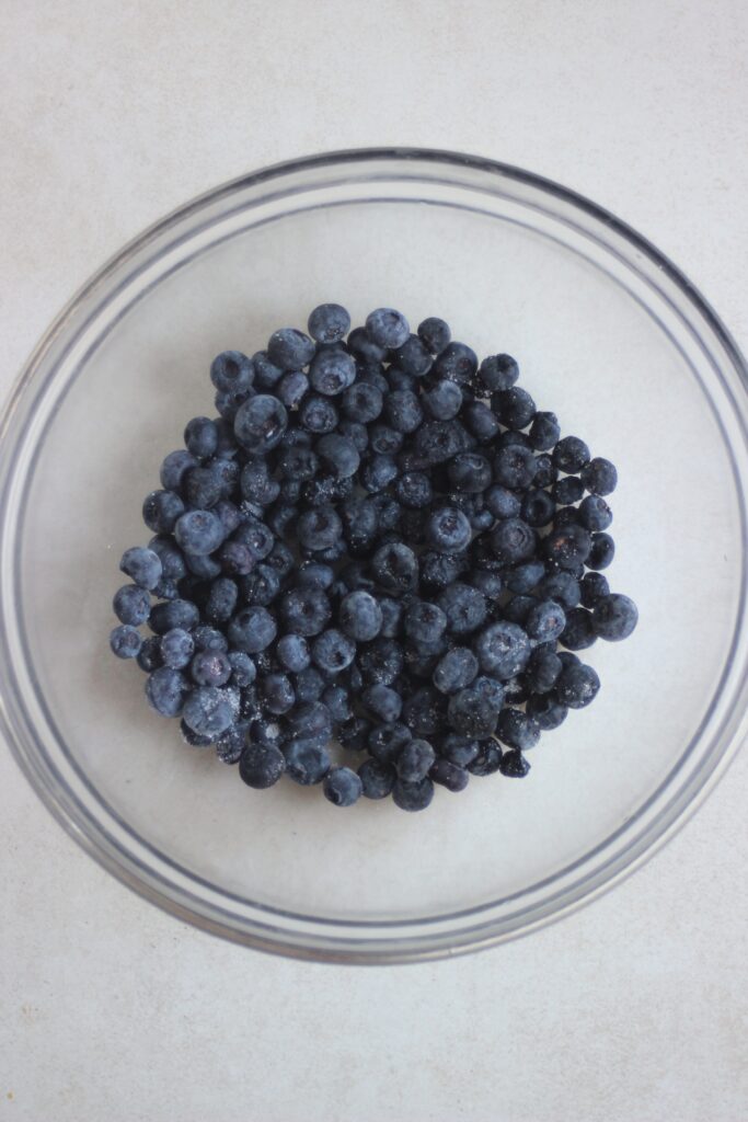 Glass bowl with blueberries.