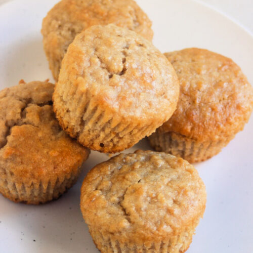 Oatmeal muffins on a white plate.