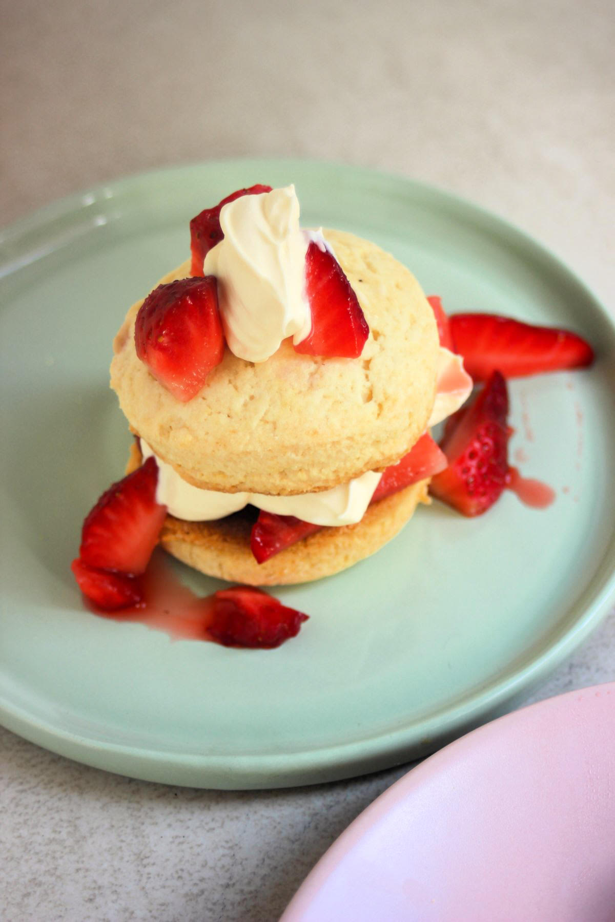 Strawberry shortcake with strawberries on the sides seen from above.