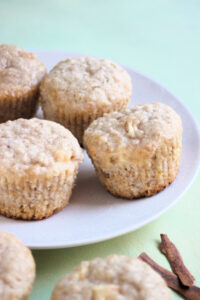 Oatmeal apple muffins on a white plate.