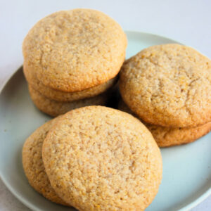 Cornmeal cookies on an aqua-green plate.