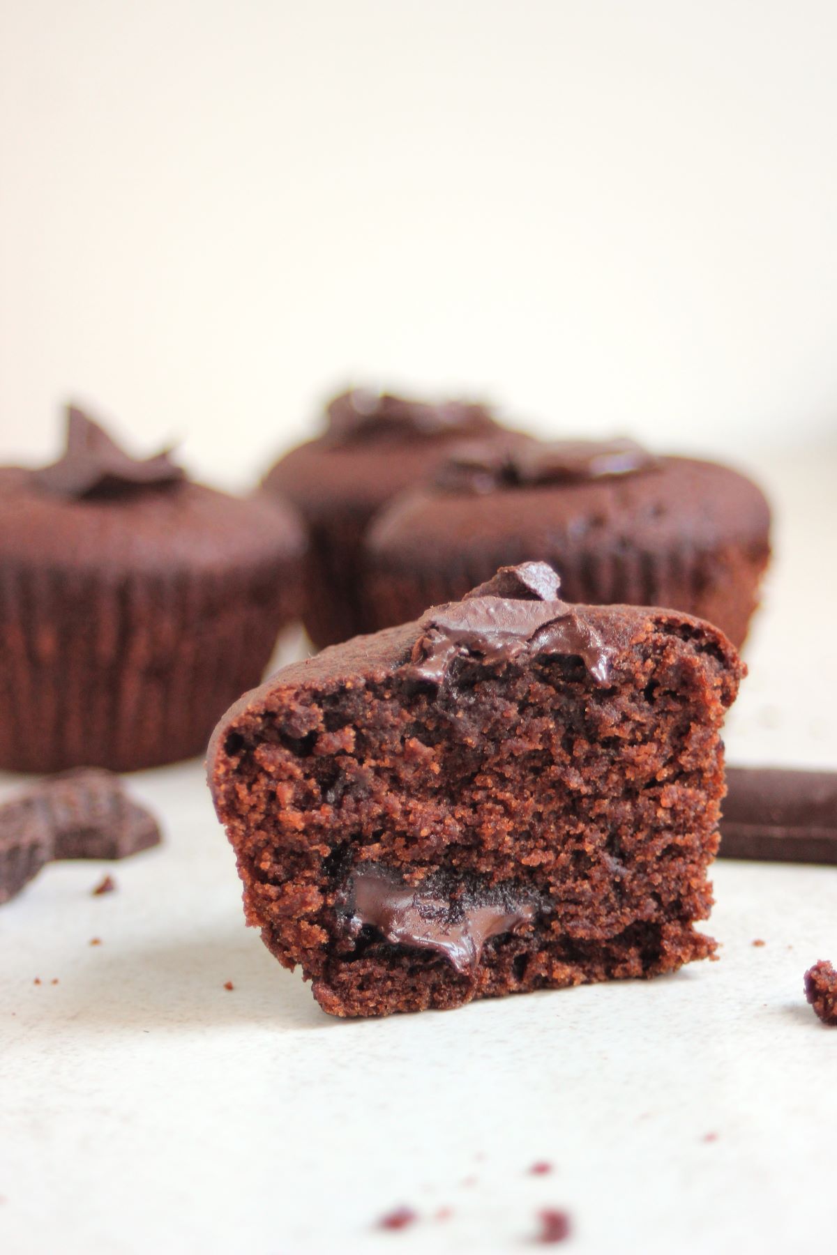 A half of a chocolate muffin viewed from the front.