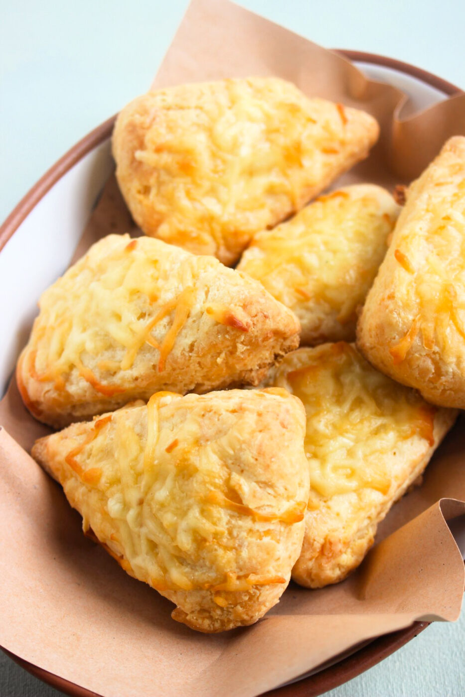 Cheese scones on a deep dish with Kraft paper.