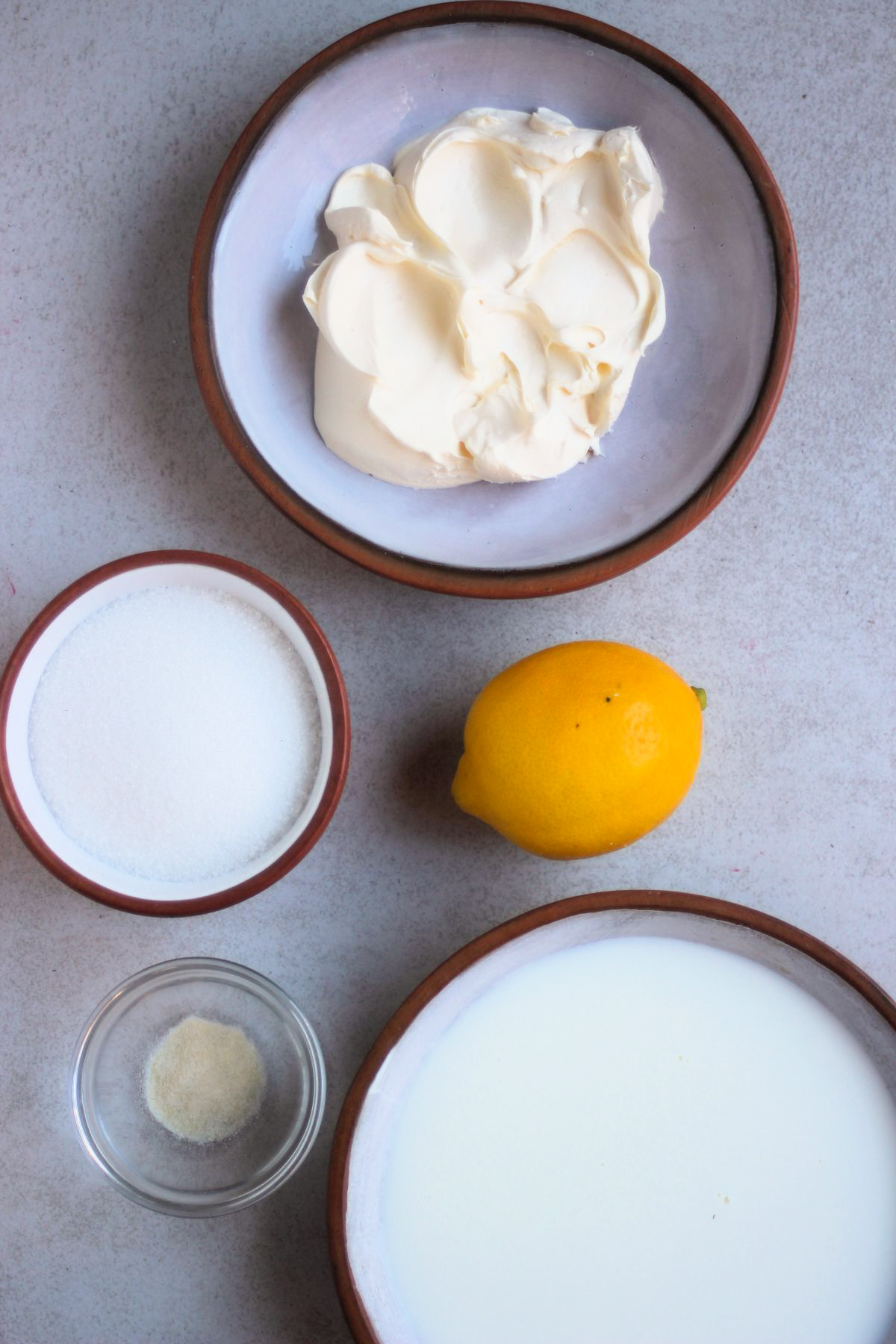 Top view of creamy lemon panna cotta ingredients.