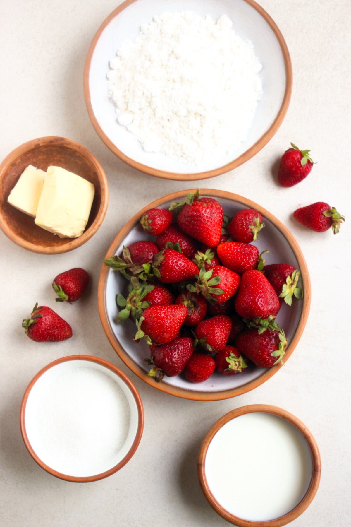 Top view of strawberry cobbler ingredients seen from above.