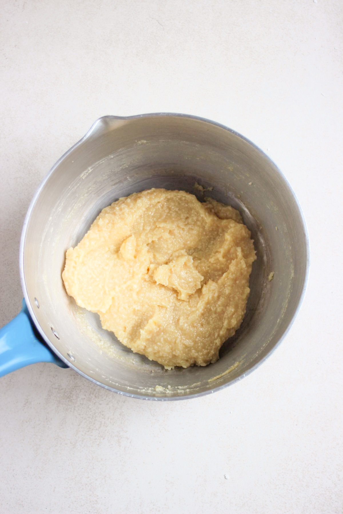 Deep pan with coconut brigadeiro batter.